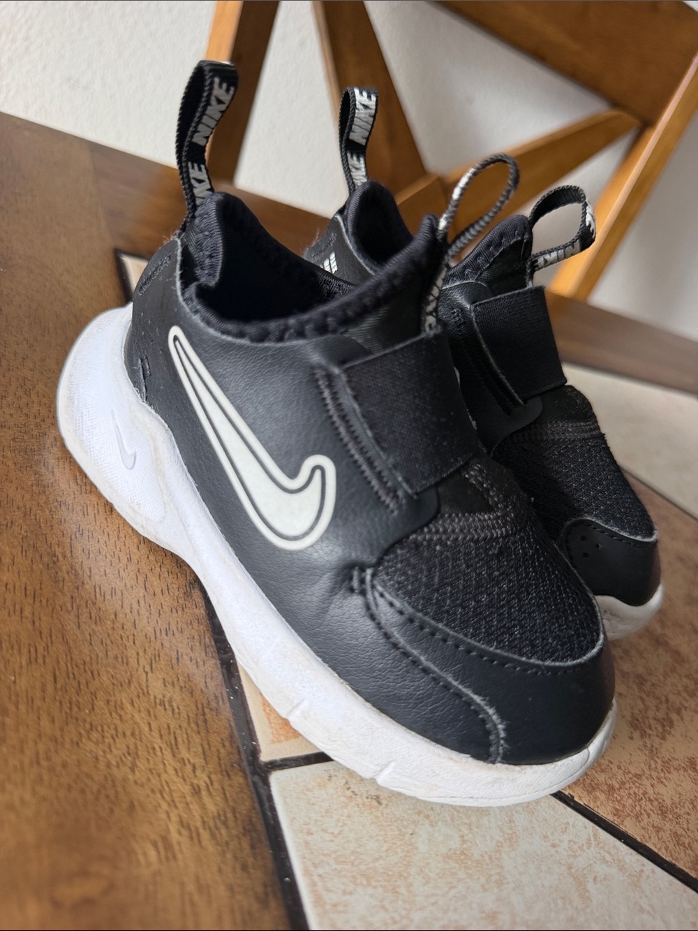 Nike Kids Black and White Slip-On Sneakers with Swoosh